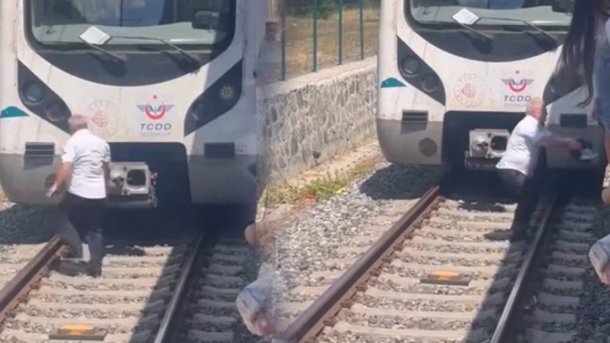 Raylara düşen kediyi kurtarmak için treni durdurdu, raylara indi