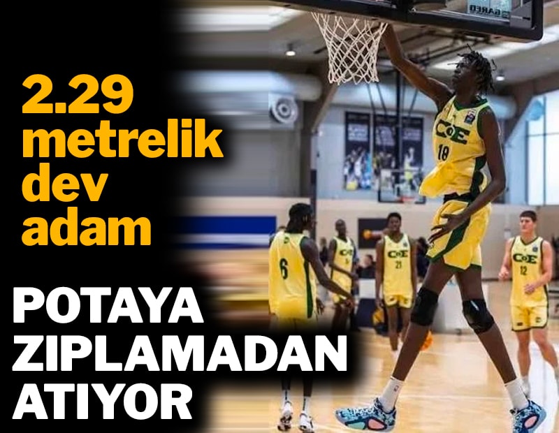 2.29 metrelik dev adam: Zıplamadan potaya atıyor