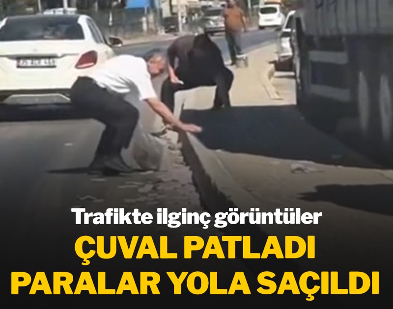Trafikte ilginç anlar! Çuval patladı paralar yola saçıldı